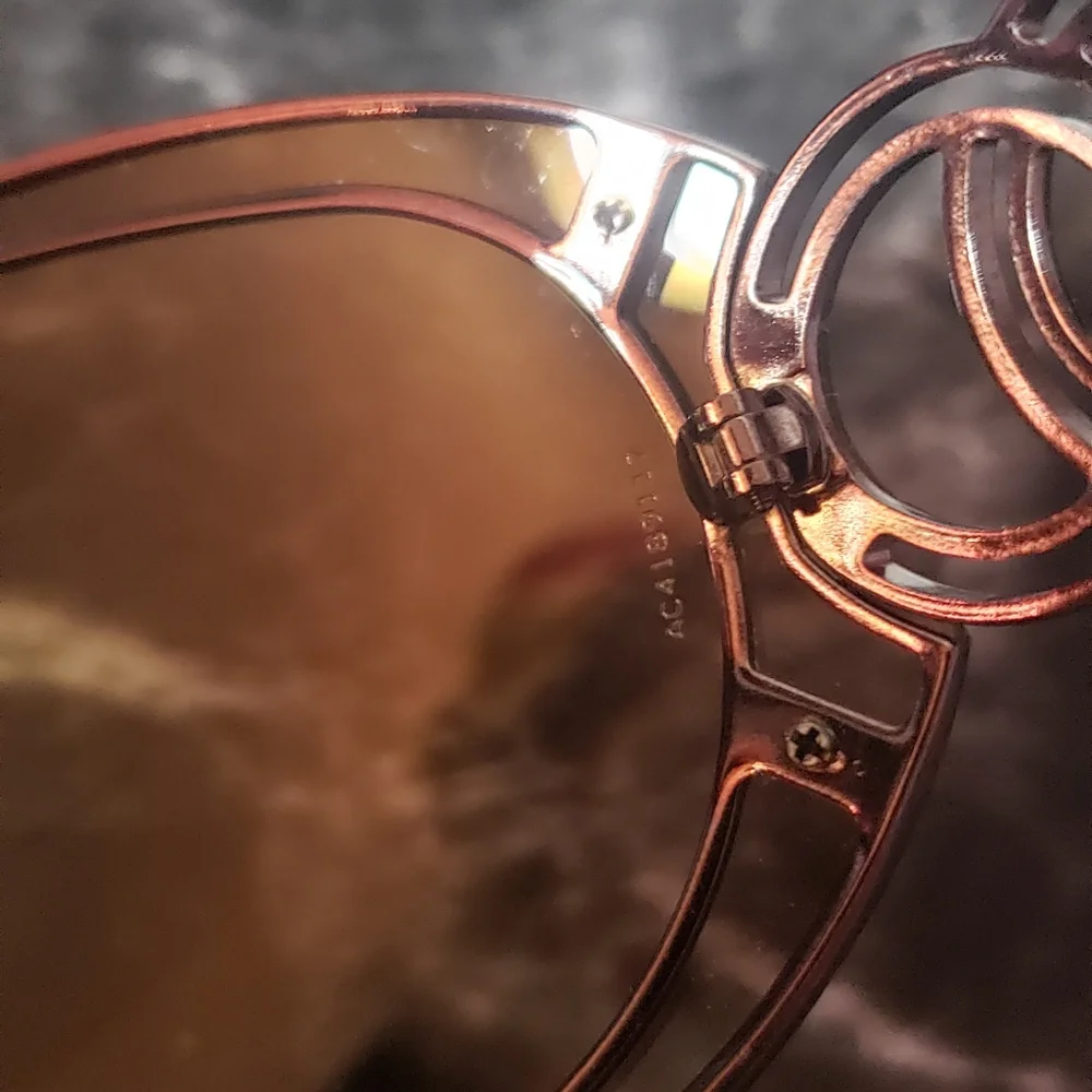 CHANEL Black Frames with Brown Gradient Lenses and Gold CC Accent Sunglasses.